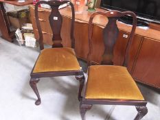A pair of dining chairs