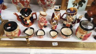 A quantity of Staffordshire character jugs and teapots