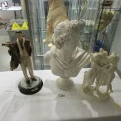 A bust of and ancient Greek/Roman, a Three Graces figure group and a male figure entitled Sebastian.