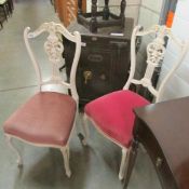A pair of painted chairs.
