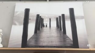 A large unframed print of canvas of a Jetty