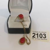 A 9ct gold ring and pendant on chain set with coral.