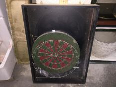 A dart board with score board