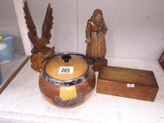 A retro biscuit barrel and continental wood figures etc.