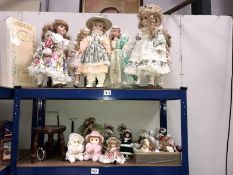 2 shelves of collectors dolls & a wooden doll's stool etc.