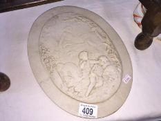 A continental marble wall plaque of Putti