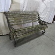 A Victorian cast iron garden bench (possibly Coalbookdale) wooden slats a/f.