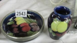 A Moorcroft wisteria small vase (approx. 3.5" / 9 cm tall) and a dish (approx. 4.75" / 12 cm wide).