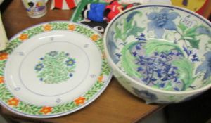 A large Wedgwood bowl decorated by Minnie Forster and a hand painted charger (unsigned).