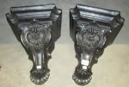 A pair of pottery wall brackets.