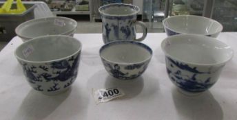 5 blue and white Chinese tea bowls and a tea cup.
