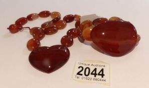 A Lola Rose carnelian necklace and bracelet.