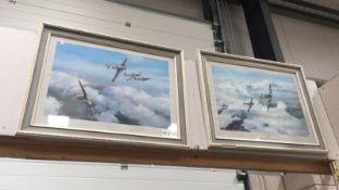 A pair of framed and glazed spitfire prints,