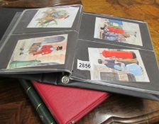 An album of postcards and 2 empty stamp albums.