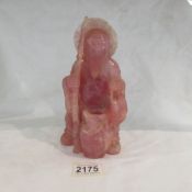 An early 19th century pink carved stone fisherman a/f.