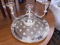 A silver plate tray and a silver plate candelabra.