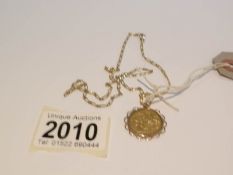 A George V 1914 half sovereign pendant in gold mount and on 14ct gold chain,