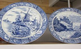 A pair of Delft blue and white chargers.
