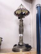 A Tiffany style table lamp with spelter base.