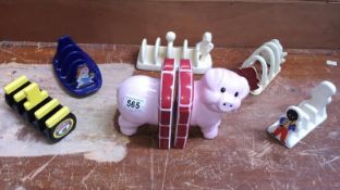 A quantity of toast racks and a set of pig bookends