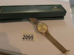 A Gentleman's Rolex precision 9ct gold watch and strap (strap hall marked Birmingham 1973).