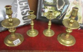 2 pairs of brass candlesticks.