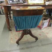 A Victorian mahogany sewing table with contents.