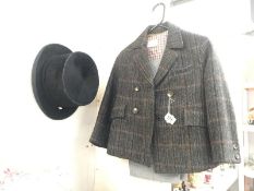 A Thomson 6 7/8 top hat and a childs tweed jacket with trousers