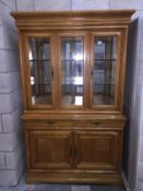 A glazed top wall cabinet