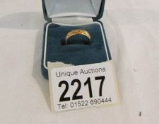 A 18ct Millenial gold ring.