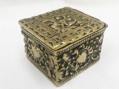 A 19th century embossed brass pill box.