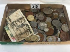 A collection of foreign coins and bank notes.