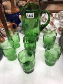 A set os green drinking glasses & jug