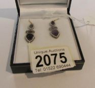 A pair of drop earrings set with pear shaped amethyst, amethysts, diamonds and pearls.