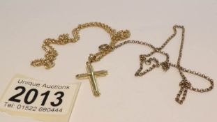 A 14ct gold cross pendant marked 14k on yellow metal chain (approximately 7 grams) together with a