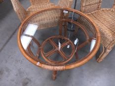A cane glass topped circular table
