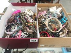 2 boxes of assorted costume jewellery.