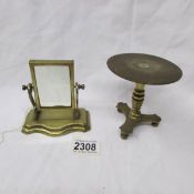 A miniature brass toilet mirror and a miniature brass table, (probably traveller's samples).