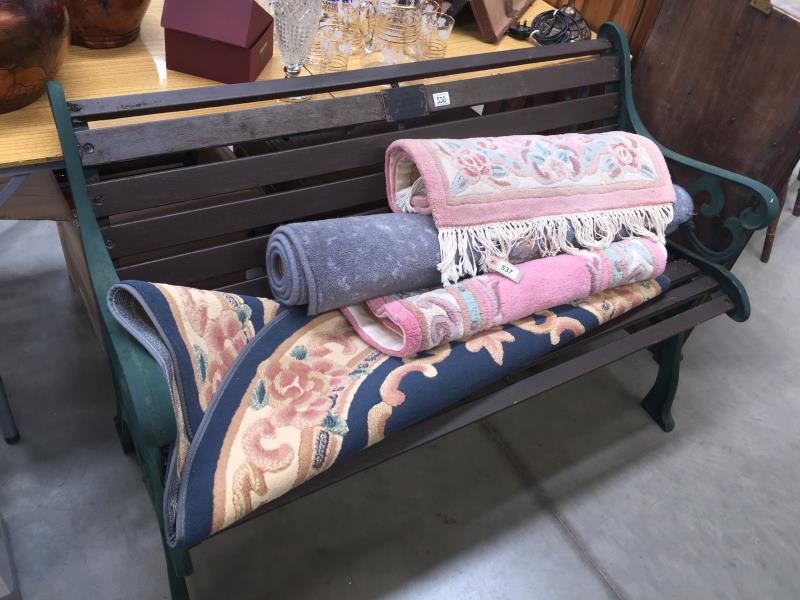 A wooden bench with metal frame and with memorial plaque dedicated to Chris Elkington (Rockin