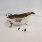 A silver sauce boat hall marked William Aitken, Birmingham 1905, approximately 84 grams.