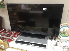 A Panasonic TV and a Panasonic DVD player (no controls)