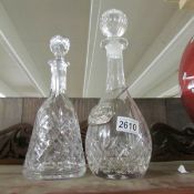 2 good quality cut glass decanters (one with label).