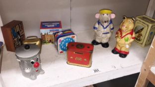 A quantity of vintage money boxes including tinplate