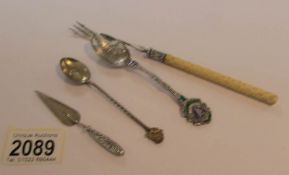 A silver pickle fork, 2 silver spoons and a silver book mark.