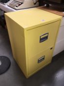 A yellow filing cabinet