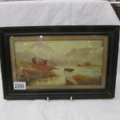 An early 20th century framed and glazed watercolour rural scene with highland cattle.