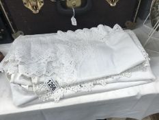 A linen & lace bedspread,