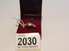 An 18ct gold ring set with solitaire diamond and with 9ct gold spacer bar, ring hall marked 18ct,