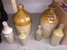 A quantity of stoneware flagons and bottles