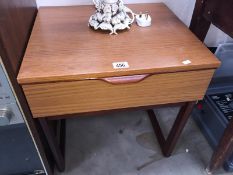 A 1970's retro bedside table with drawer
